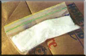 Photo of white powder inside a small plastic bag.