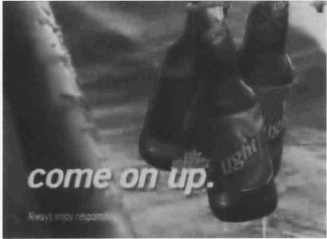 Exhibit I: Bottles of Labatt Light beer hanging with the caption 'come on up'.