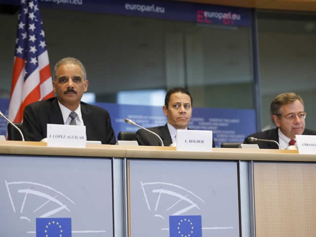 Attorney General Holder sits alongside members of the European Parliament during his appearance  before the Committee on Civil Liverties, Justice and Home Affairs.