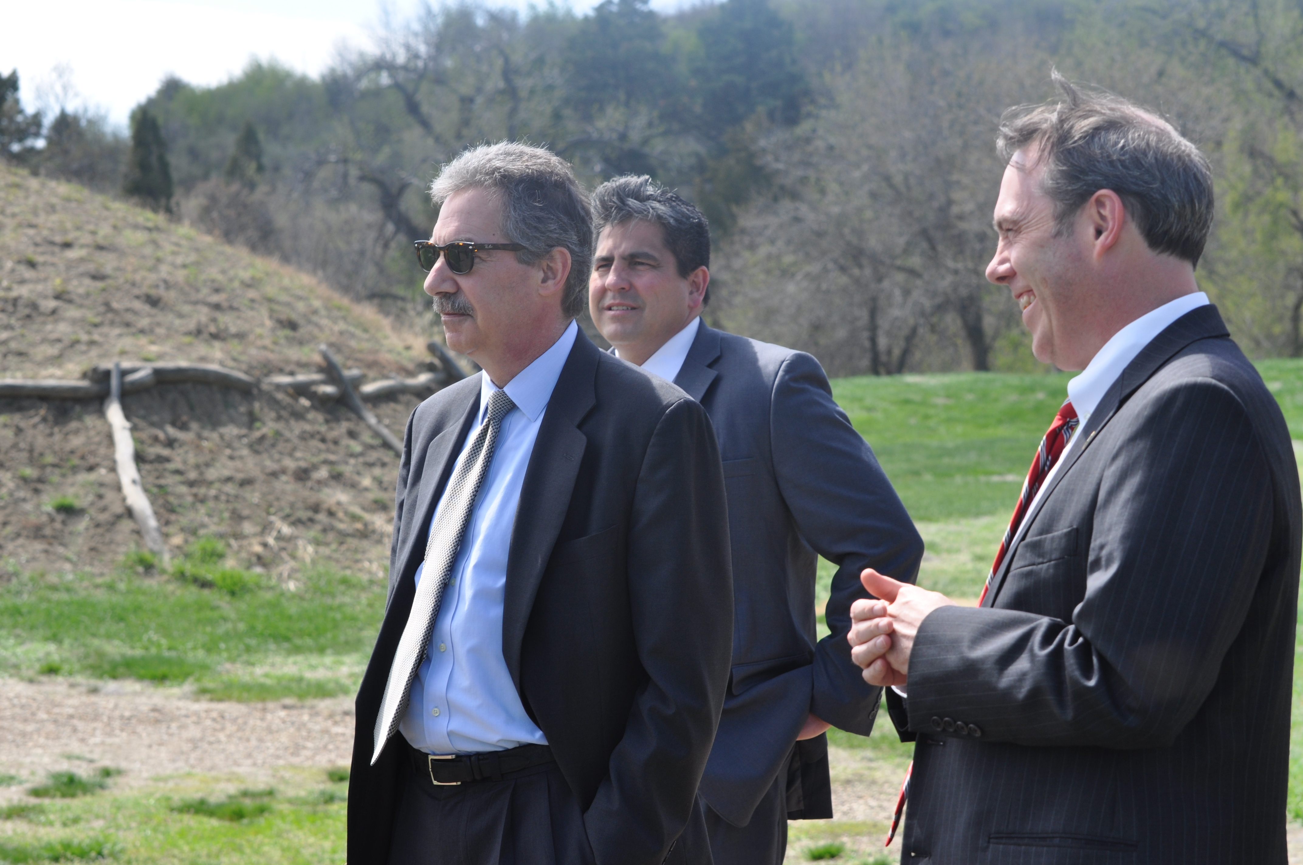 DAG Cole,  AAG Gary Delorme and U.S. Attorney Tim Purdon at the recreated Mandan Village at the Fort Abraham Lincoln State Park