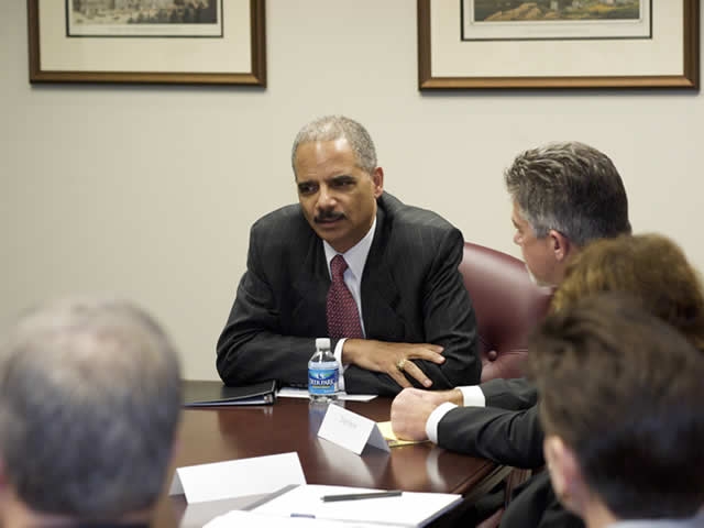 Attorney General Holder, sitting down with EOIR employees.
