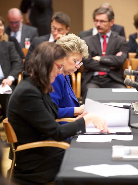 European Union Principal Vice-President and Commissioner for Justice Viviane Reding and EU Commissioner for Home Affairs Cecilia MalmstrÃ¶m look over meeting materials.