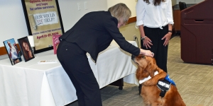 U.S. Attorney Teresa Moore presented the award to Rasta and his owner, Jennifer Vernon.