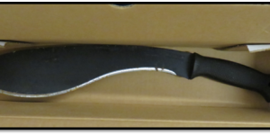 A picture containing a large machete with a curved blade.