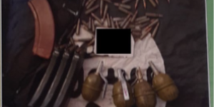 ISIS Photograph An image of ammunition, and grenades on top of an ISIS flag.