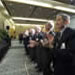 Guests stand and applaud at award ceremony