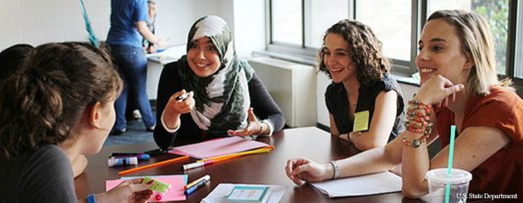 Who We Work With - Schools Students talking around a cafeteria table