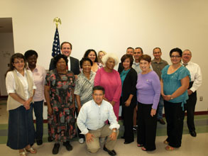 U.S. Attorney Dennis K. Burke (next to flag) thanks members of the Yuma Weed & Seed group for helping make their communities safer.(May 2011)