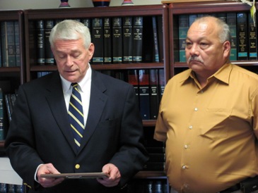 U.S. Attorney Mike Cotter presenting an award to Henry Devereaux