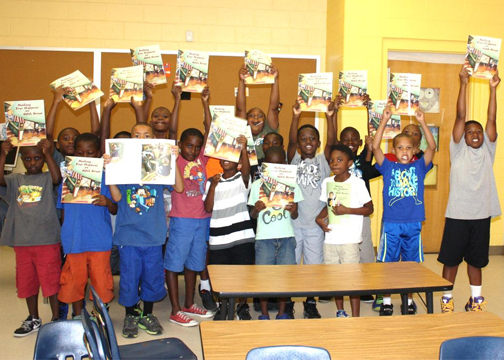Class of 7-8 years old boys at Carver Family YMCA Summer Camp on July 16, 2014, thanking Mayor Reed for their book “Nothing Ever Happens on 90th Street.” 