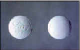 Photograph of two white tablets.