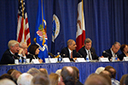 Department of Justice and Department of Agriculture officials discuss competition and regulatory issues in the agriculture industry with a panel of state and congressional officials at the agriculture workshop in Iowa.