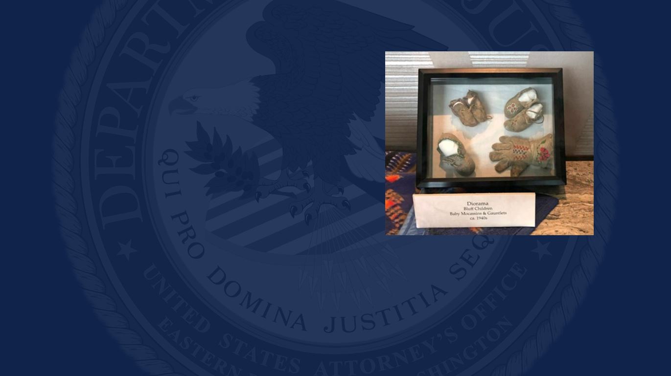 Shadowbox containing moccasins 