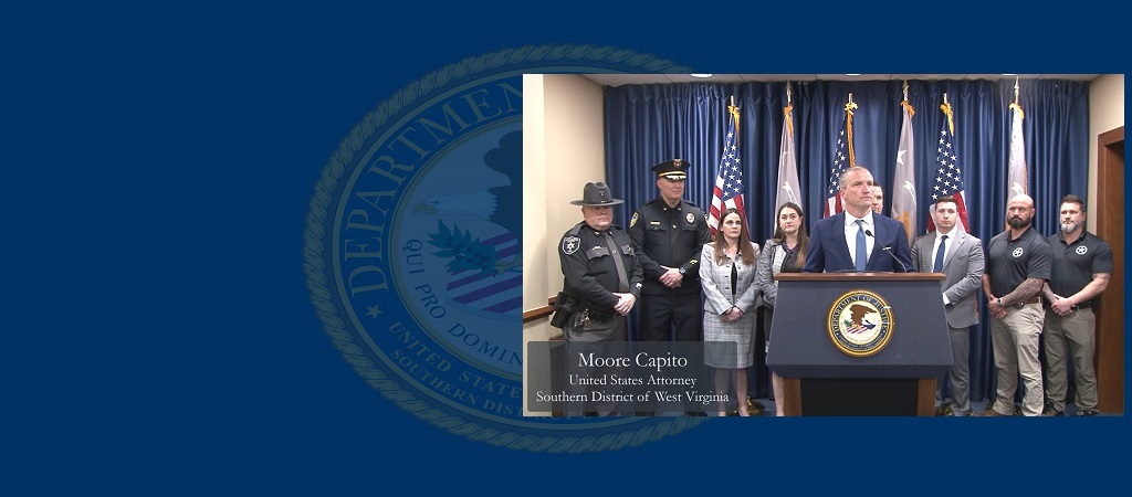 Screenshot of February 9, 2026, press conference with U.S. Attorney Moore Capito at the podium and the prosecution team and law enforcement officials behind him, as he announces the sentences imposed on sex trafficking conspirators Tiwan Robert Bailey and Carrie Roy.
