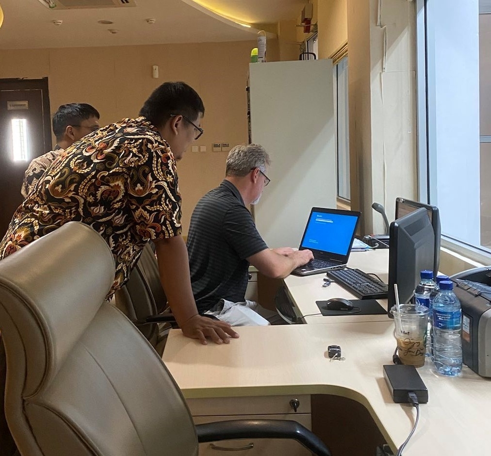 Project TERMINUS team members working on upgrades to Indonesia's border security systems.