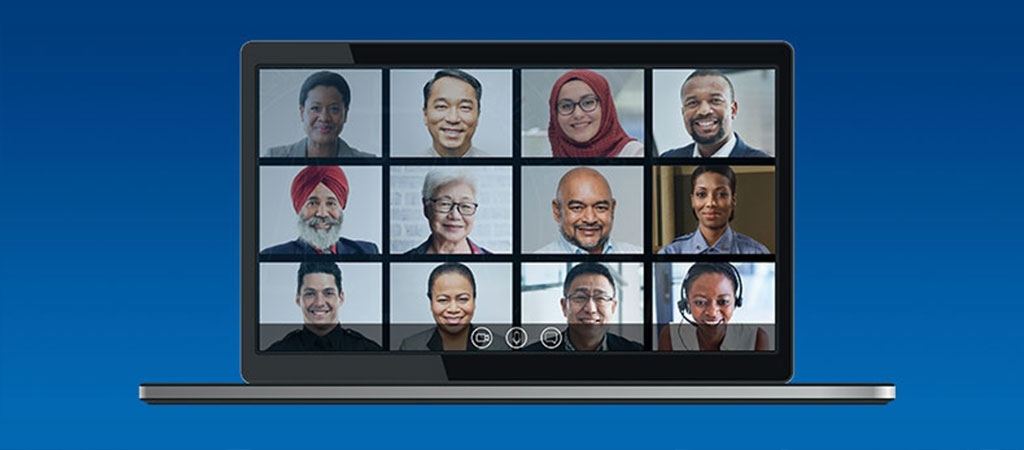 An image of a laptop showing a virtual meeting with a diverse group of participants.
