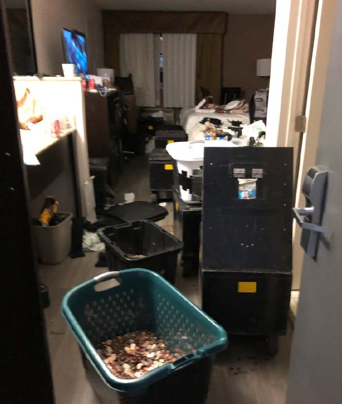 Hotel room showing baskets of stolen coins.