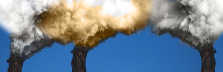 Smokes stacks spewing pollutants into the air. Photo by ENRD