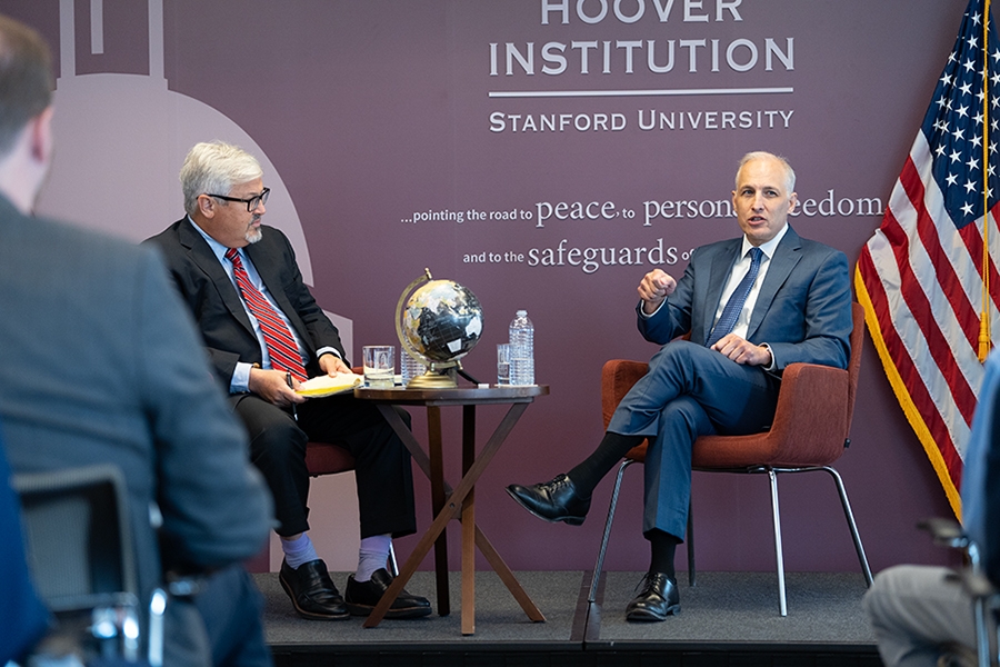 Assistant Attorney General Matthew G. Olsen speaks with the Hoover Institution’s Jack Goldsmith while seated during a Q&A