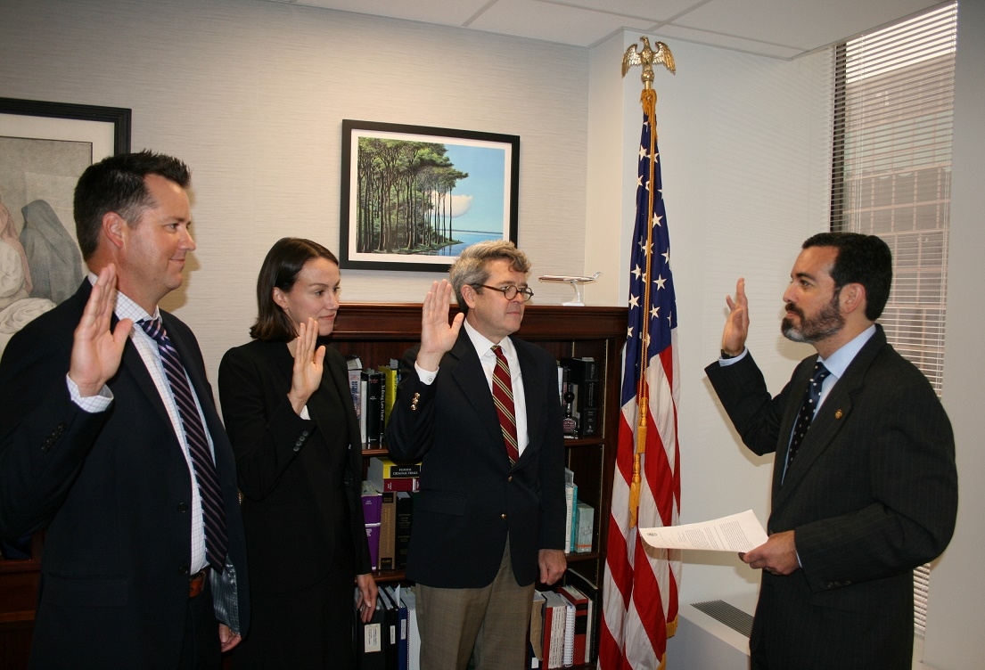 Swearing-in of AUSAs (L-R) Peter I Roklan, Julianne Landsvik Klein, and Kevin M. Bolan by United States Attorney Zachary A. Cunha