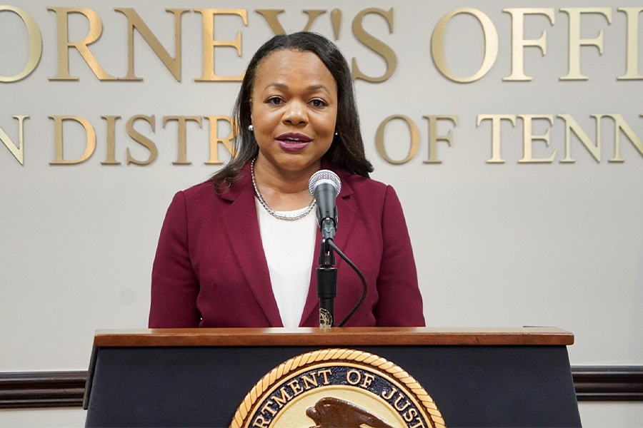 Assistant Attorney General for Civil Rights Kristen Clarke delivers remarks from a podium at the U.S. Attorney’s Office for the Western District of Tennessee.