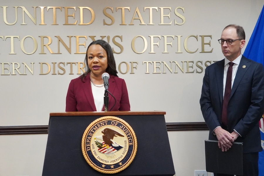 Assistant Attorney General for Civil Rights Kristen Clarke delivers remarks from a podium at the U.S. Attorney’s Office for the Western District of Tennessee.