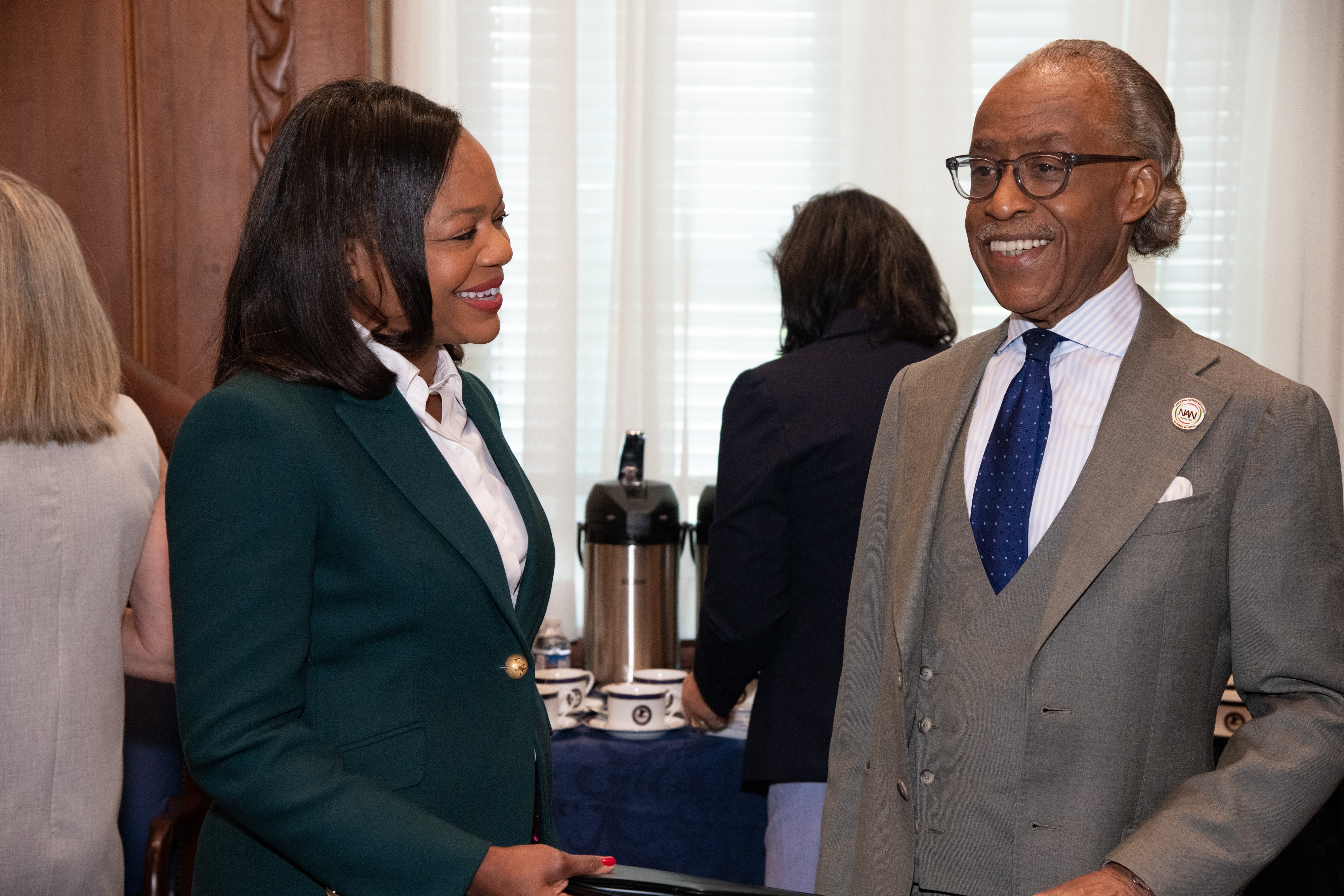 Assistant Attorney General Kristen Clarke (left) with Rev. Al Sharpton (right).