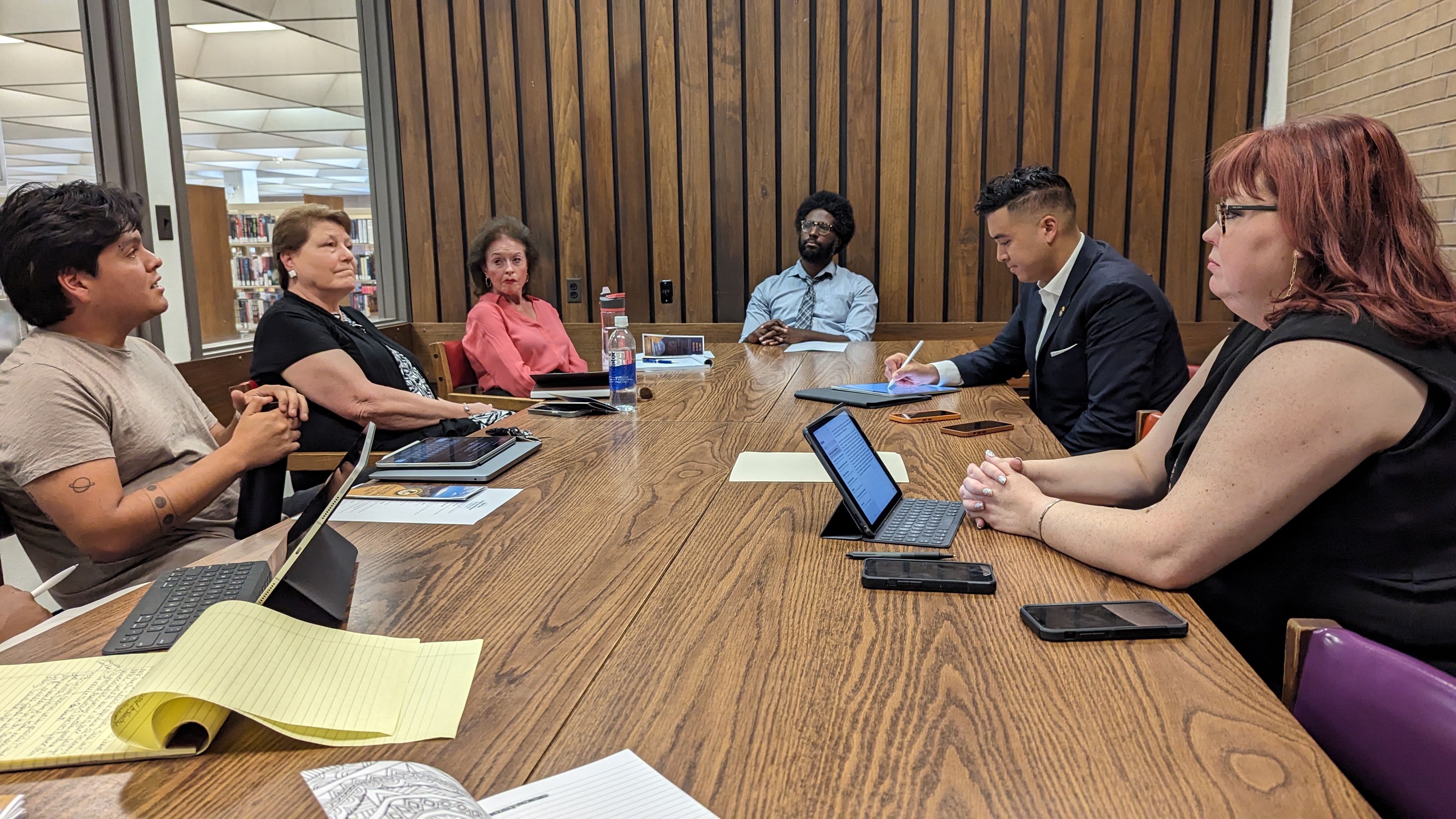 group of people sitting round a table