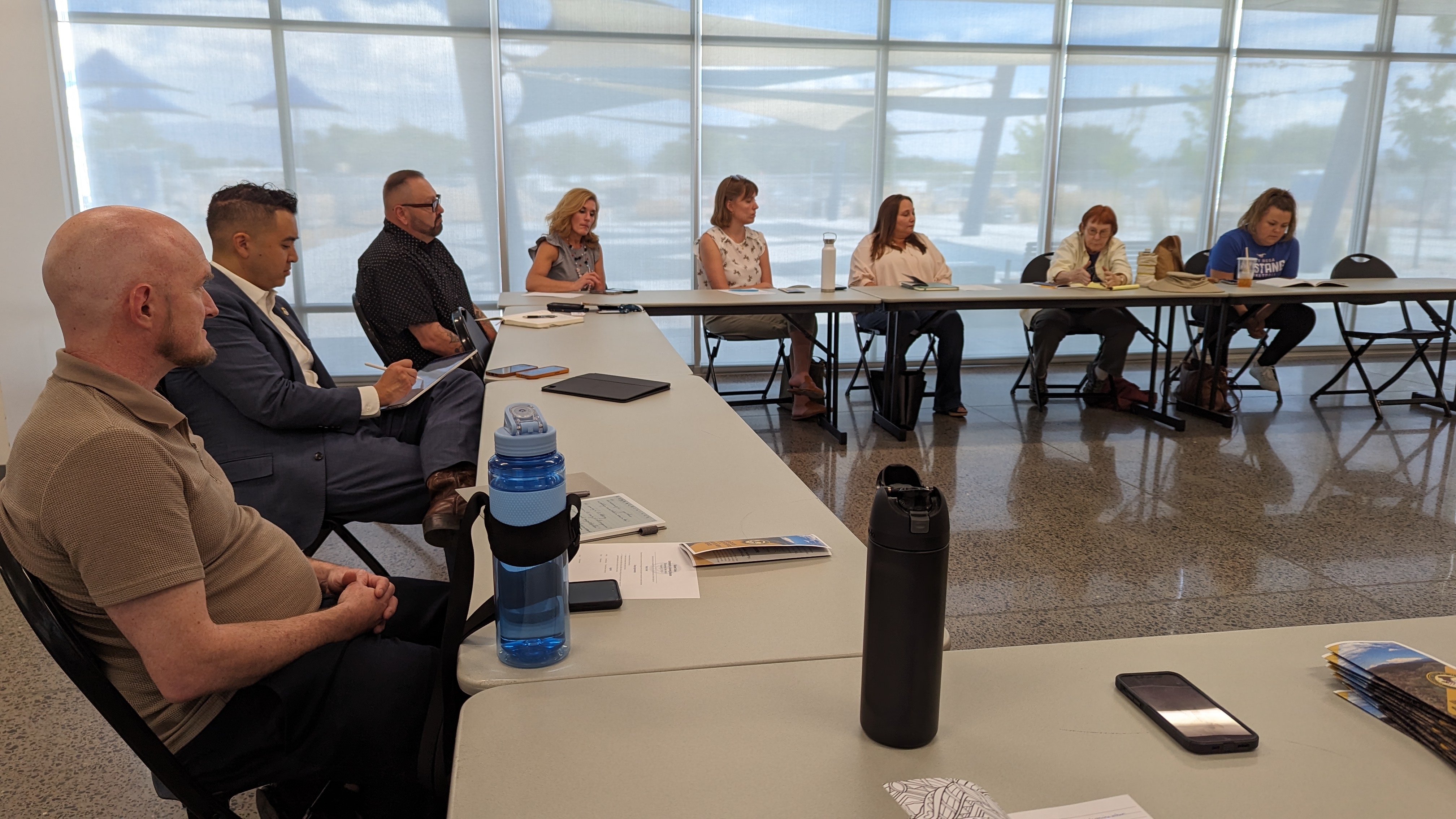 a group of people sitting around tables
