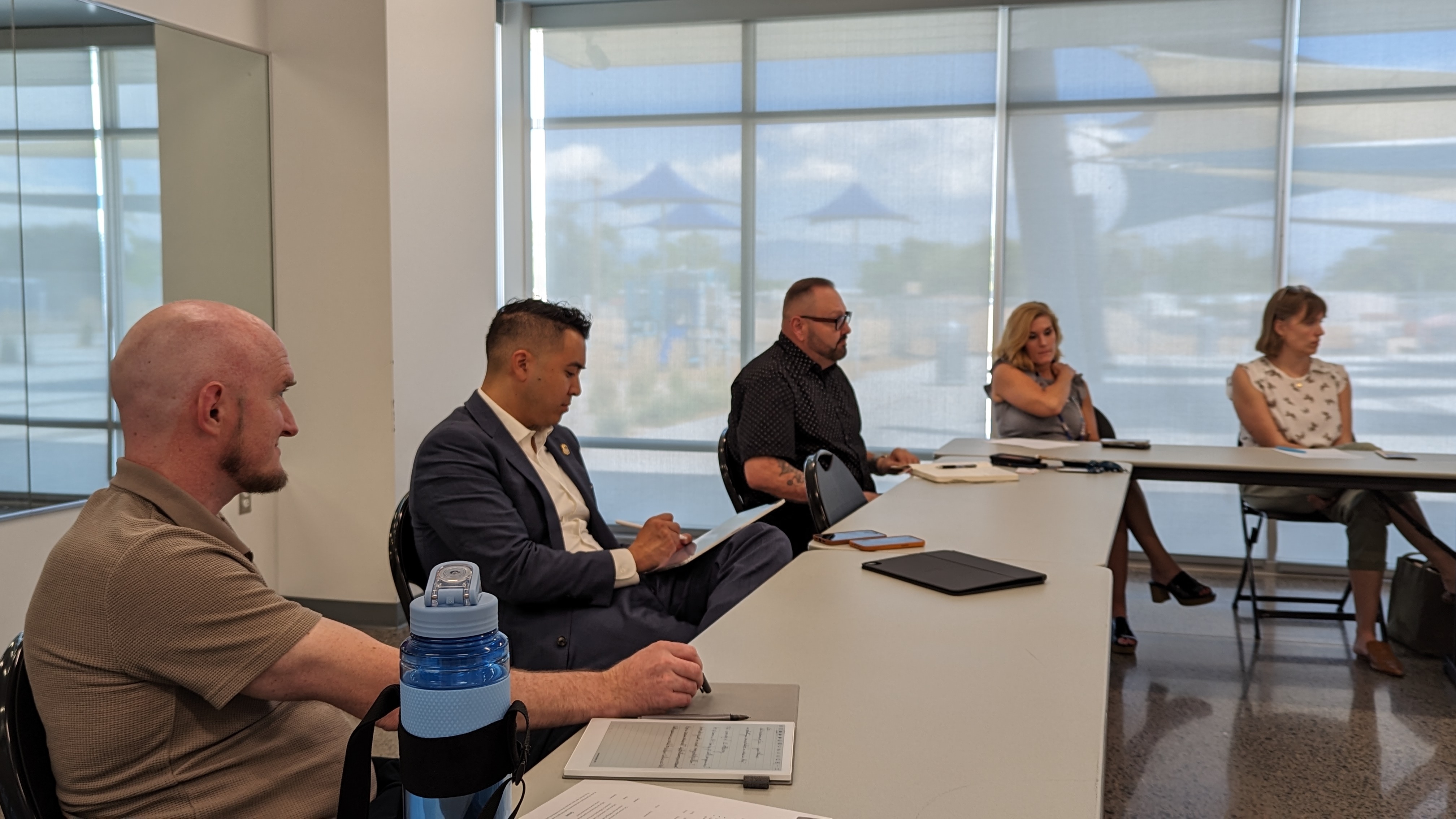 a group of people sitting around a table