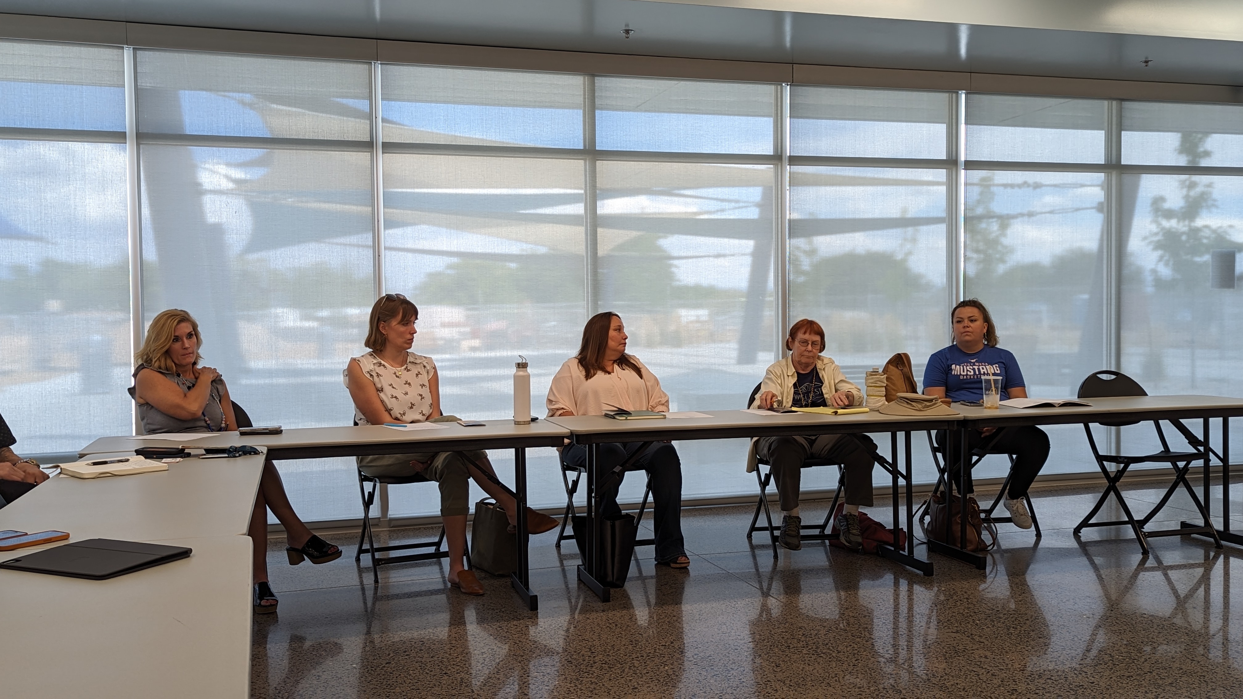 a group of people sitting around a table
