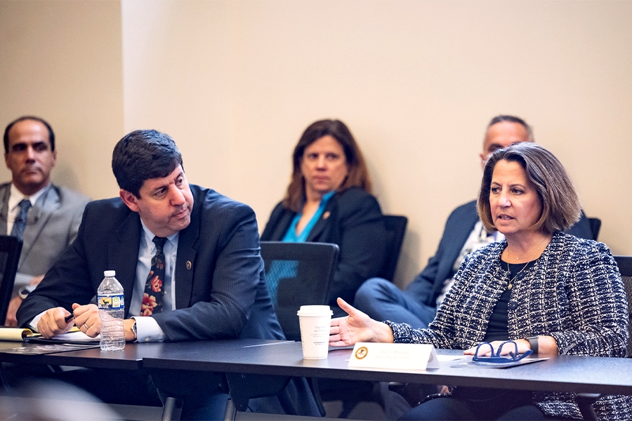 Director Steve Dettelbach of the Bureau of Alcohol, Tobacco, Firearms and Explosives (left) listens to roundtable comments from Deputy Attorney General Lisa O. Monaco (right).