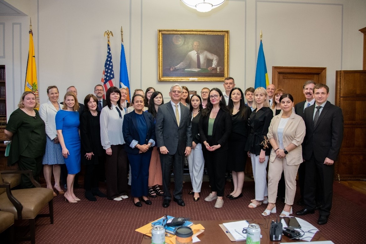 AG Garland with DOJ officials and others