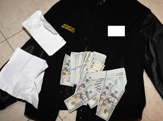 Picture of jacket bearing Menendez’s name with money on top of it