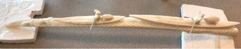 carving of kayakers