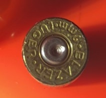 Photo of a 9mm FC Luger shell casing from the scene