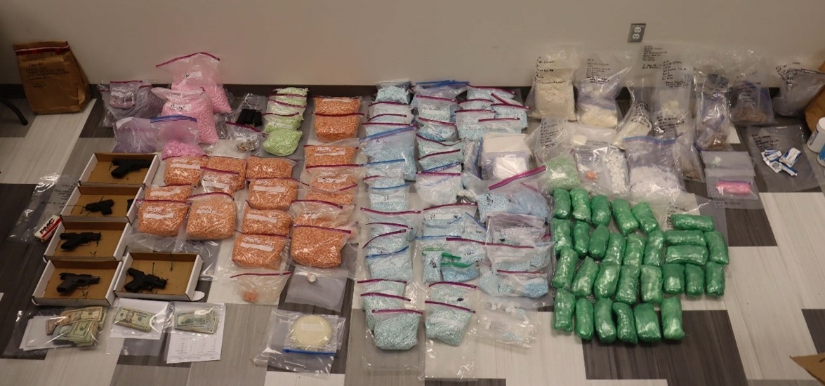 Green cellophaned-wrapped packages of suspected raw methamphetamine, heat-sealed packages believed to contain fentanyl, and lactose that is a common cutting agent.