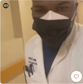 Selfie of Brightman wearing lab coat