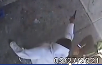 Photo showing the defendant firing his weapon