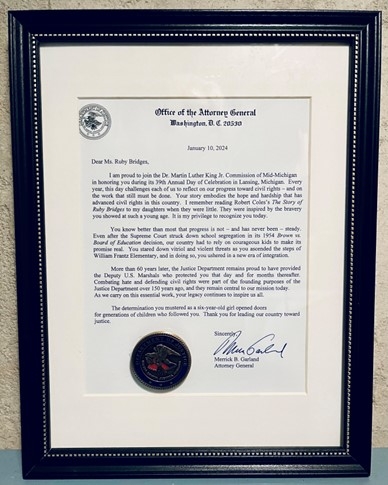 An image of the letter of tribute from Attorney General Merrick Garland, presented by U.S. Attorney Mark Totten