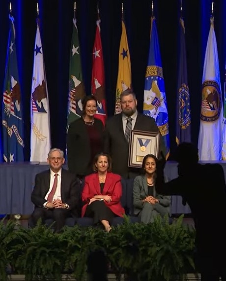 Mr. Treadway with award and leadership of DOJ
