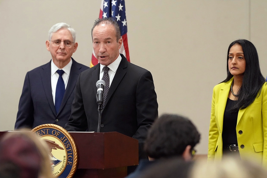 COPS Director Hugh Clements, Jr. delivers remarks from a podium at the Herby Ham Activity Center in Uvalde, Texas. To the left is Attorney General Merrick B. Garland and to the right is Associate Attorney General Vanita Gupta.