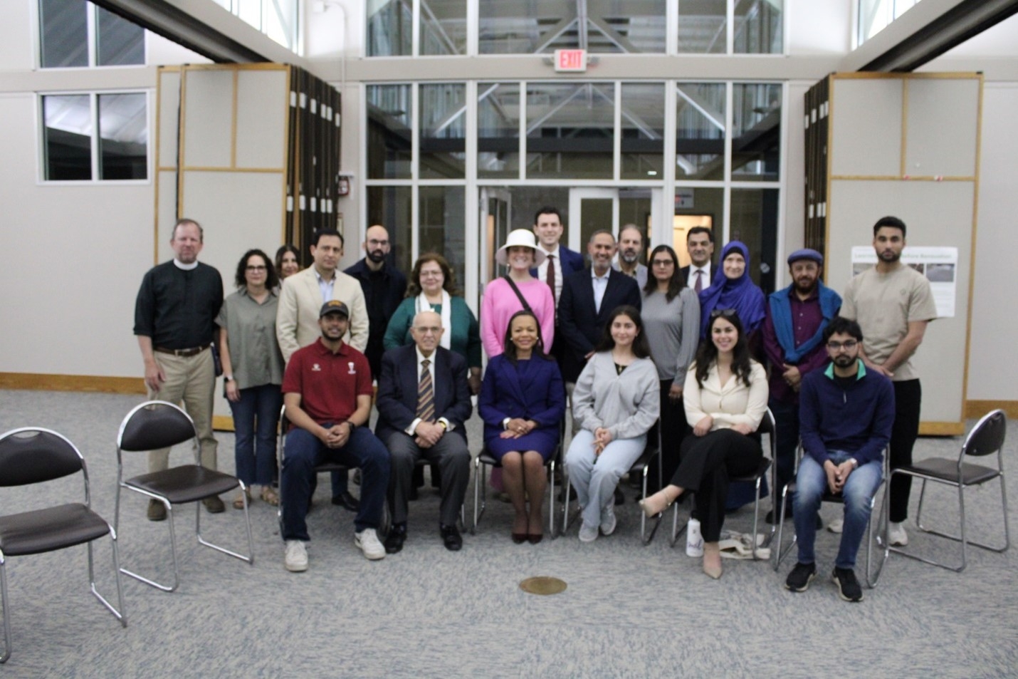 Assistant Attorney General Clarke with interfaith leaders and USC students at a community meeting at the All Saints Church.
