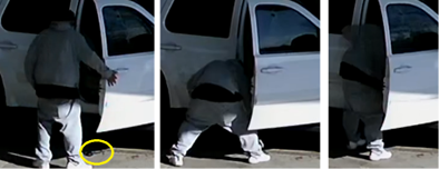 Photo from surveillance video showing Avis Coward exiting vehicle. A gun is pictured on the ground next to Coward.