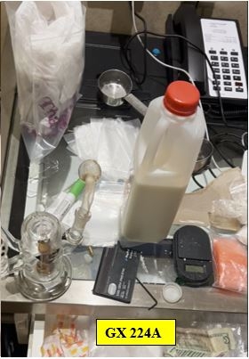 Image of drug paraphernalia and cash