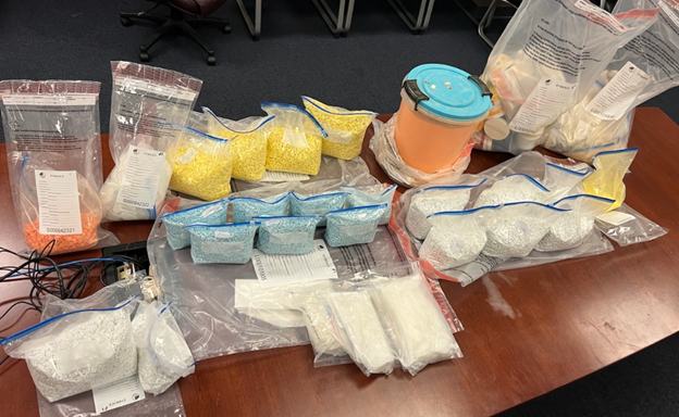 Photo of the suspected narcotics and pill presses recovered from the Gerard Avenue Building