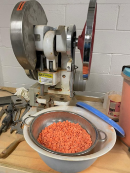 Photo of the suspected narcotics and pill presses recovered from the Gerard Avenue Building