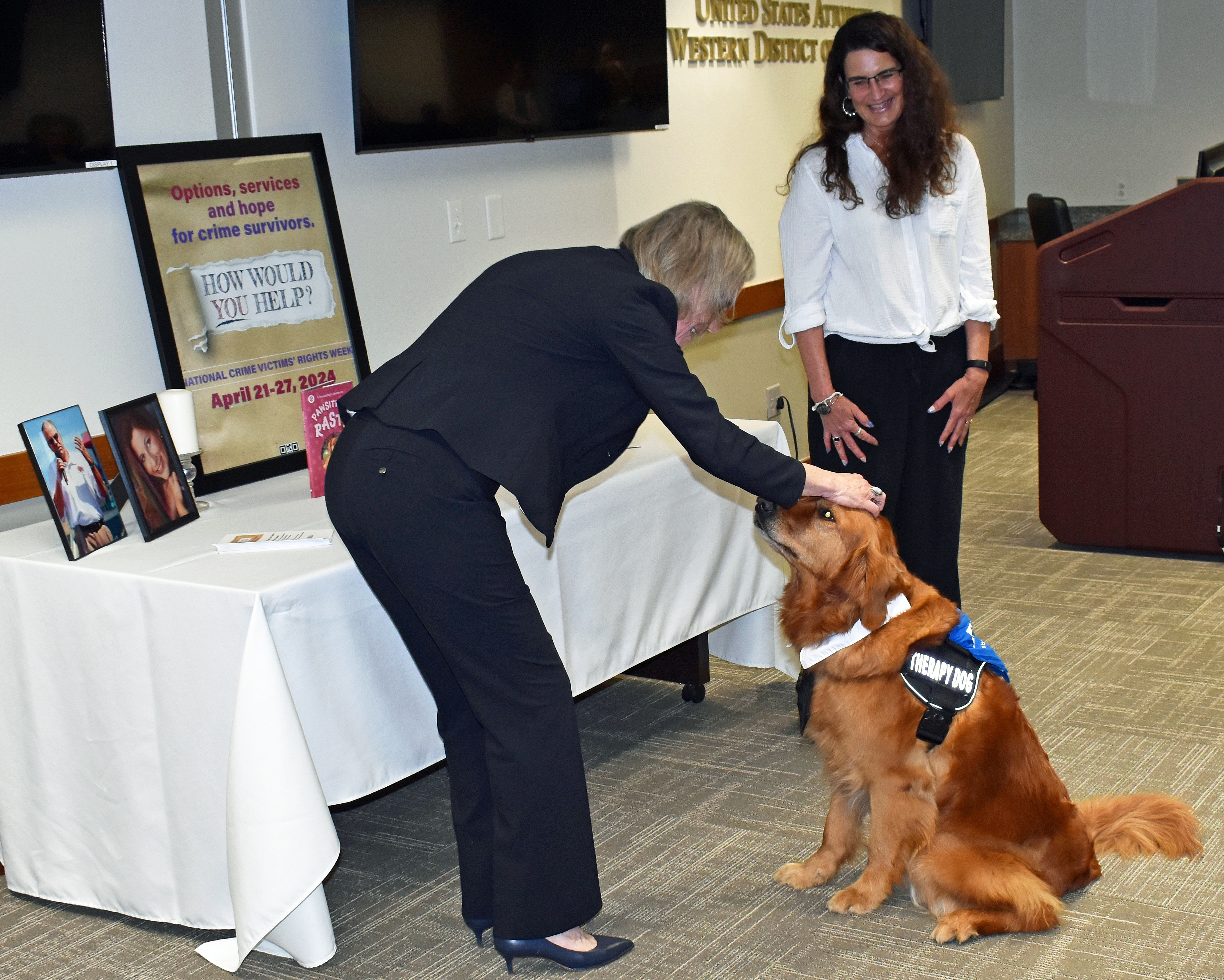 U.S. Attorney Teresa Moore presented the award to Rasta and his owner, Jennifer Vernon.
