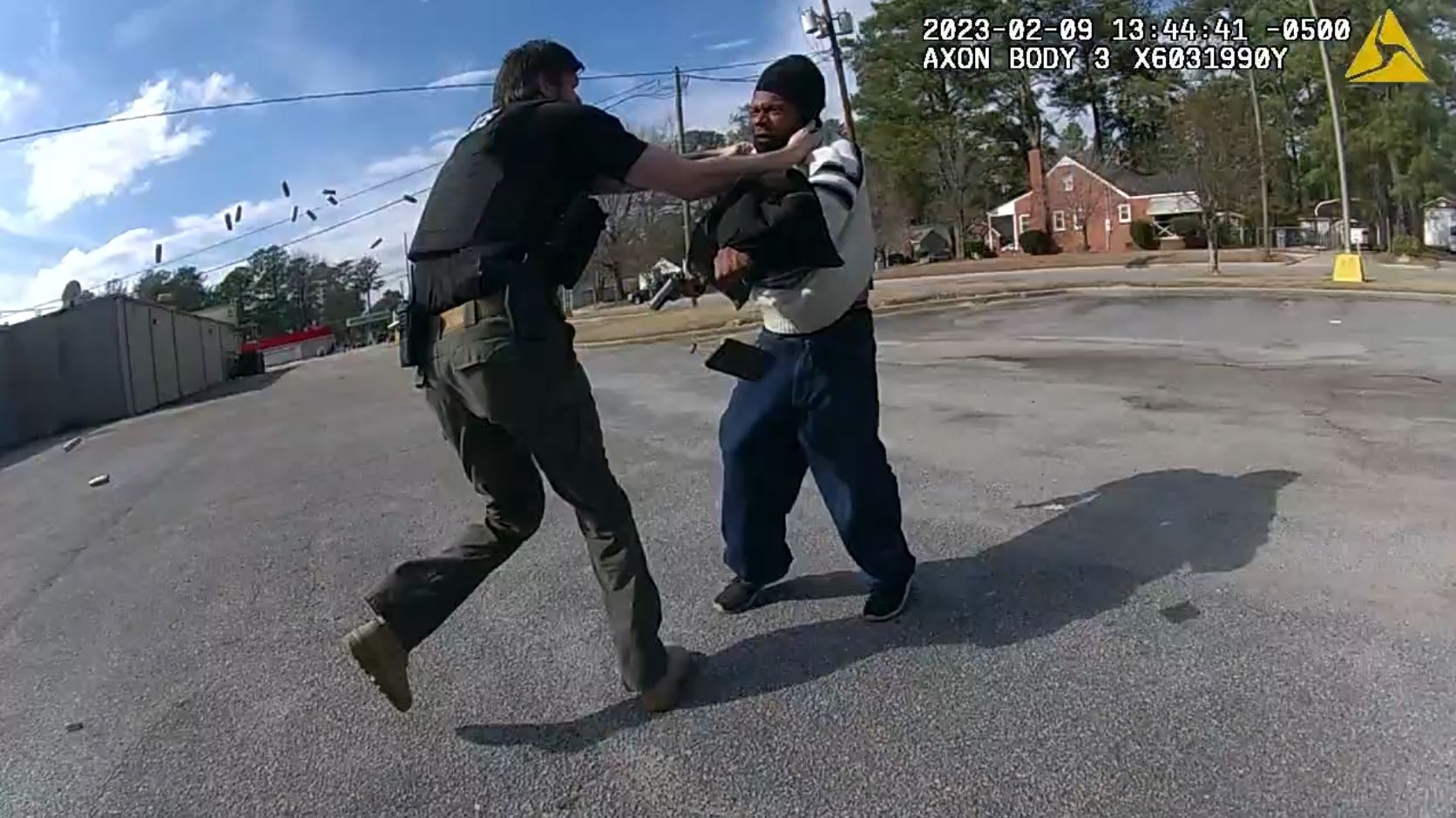 Man pointing gun at officer