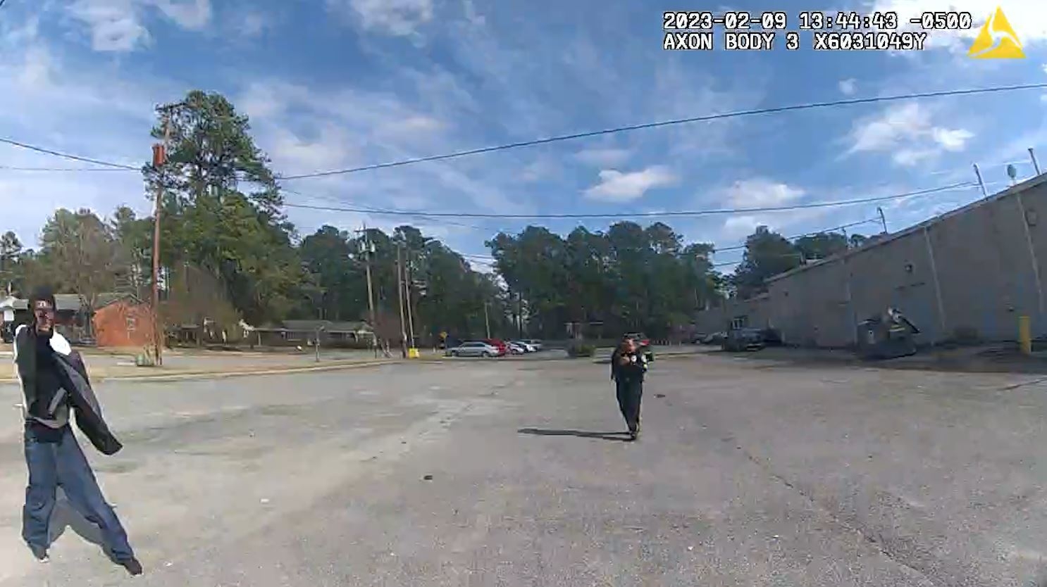 Man pointing gun at officer